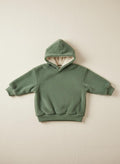 Moss hoodie on a beige background