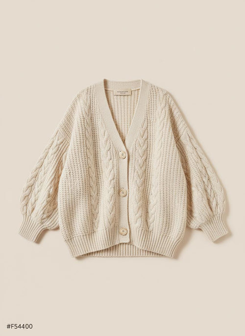 Ember cable knit cardigan on a beige background